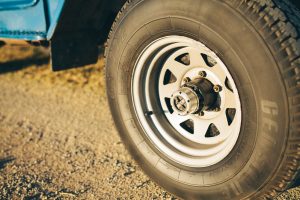front right tire on a Toyota Landcruiser J40 driving on a dirt road