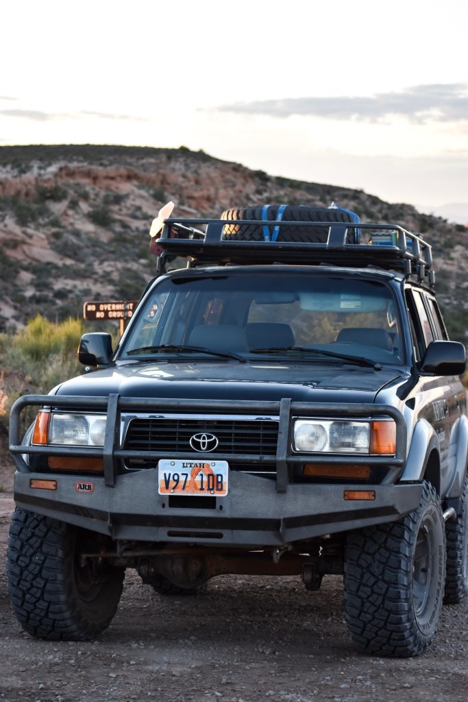 Toyota car in the mountains with luggage on its overhead