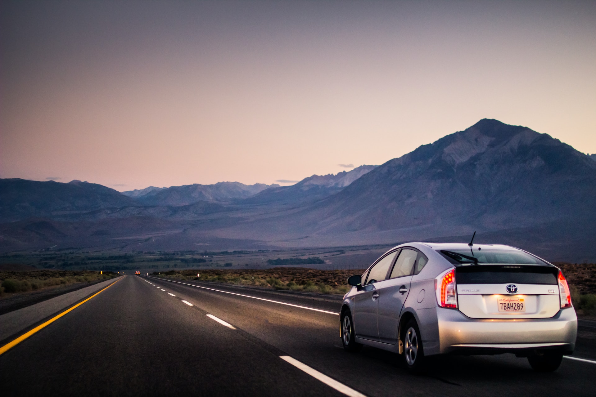 Toyota Car driving through the mountains during sunset